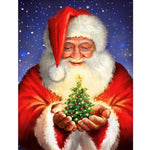Christmas Tree In Santa Hands - Diamond Painting Kit