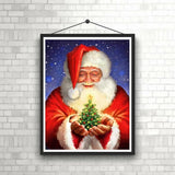 Christmas Tree In Santa Hands - Diamond Painting Kit